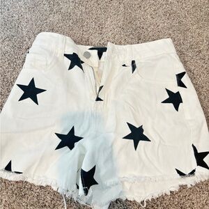 white jeans with black star design